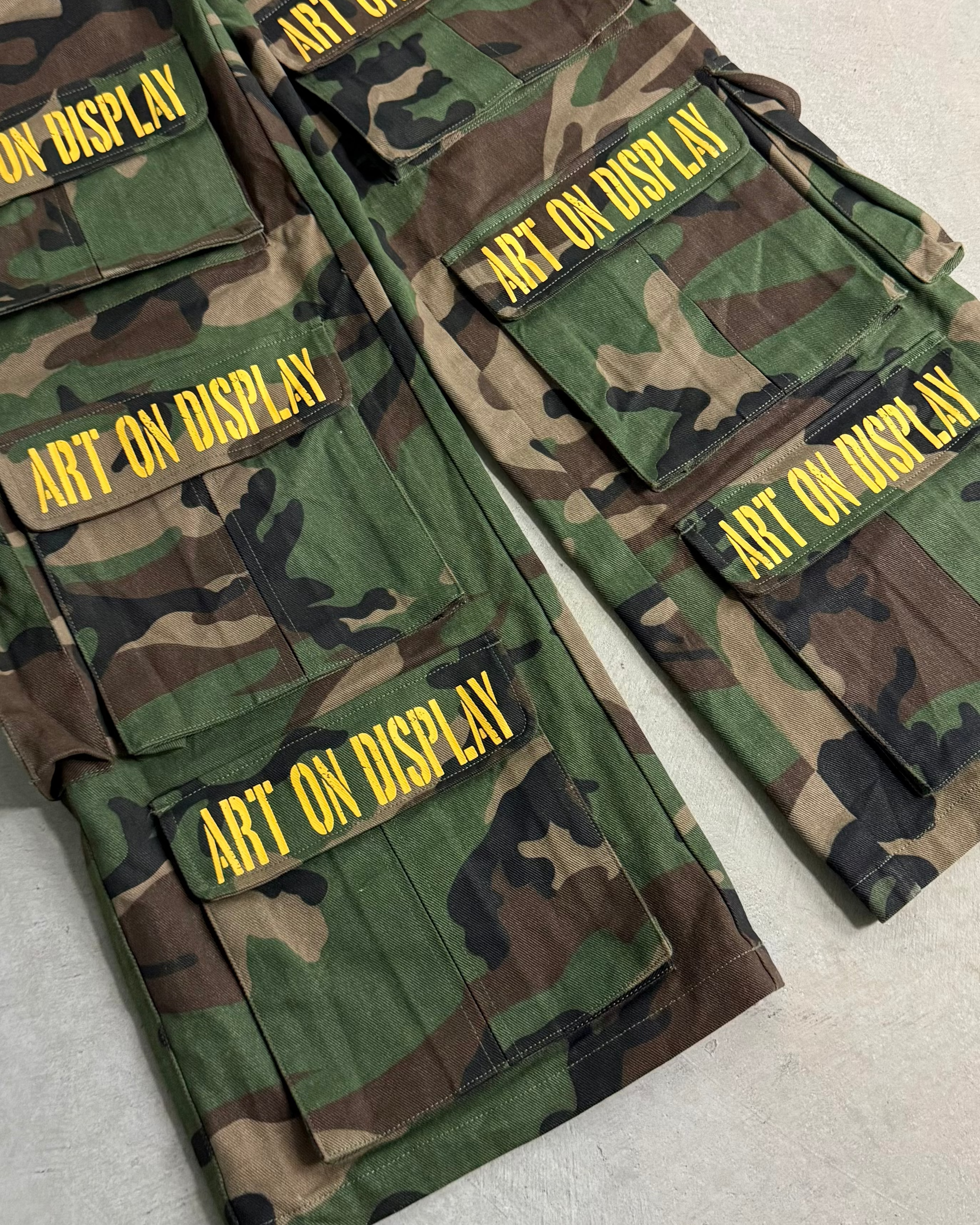 'ART ON DISPLAY' CAMO CARGO PANTS