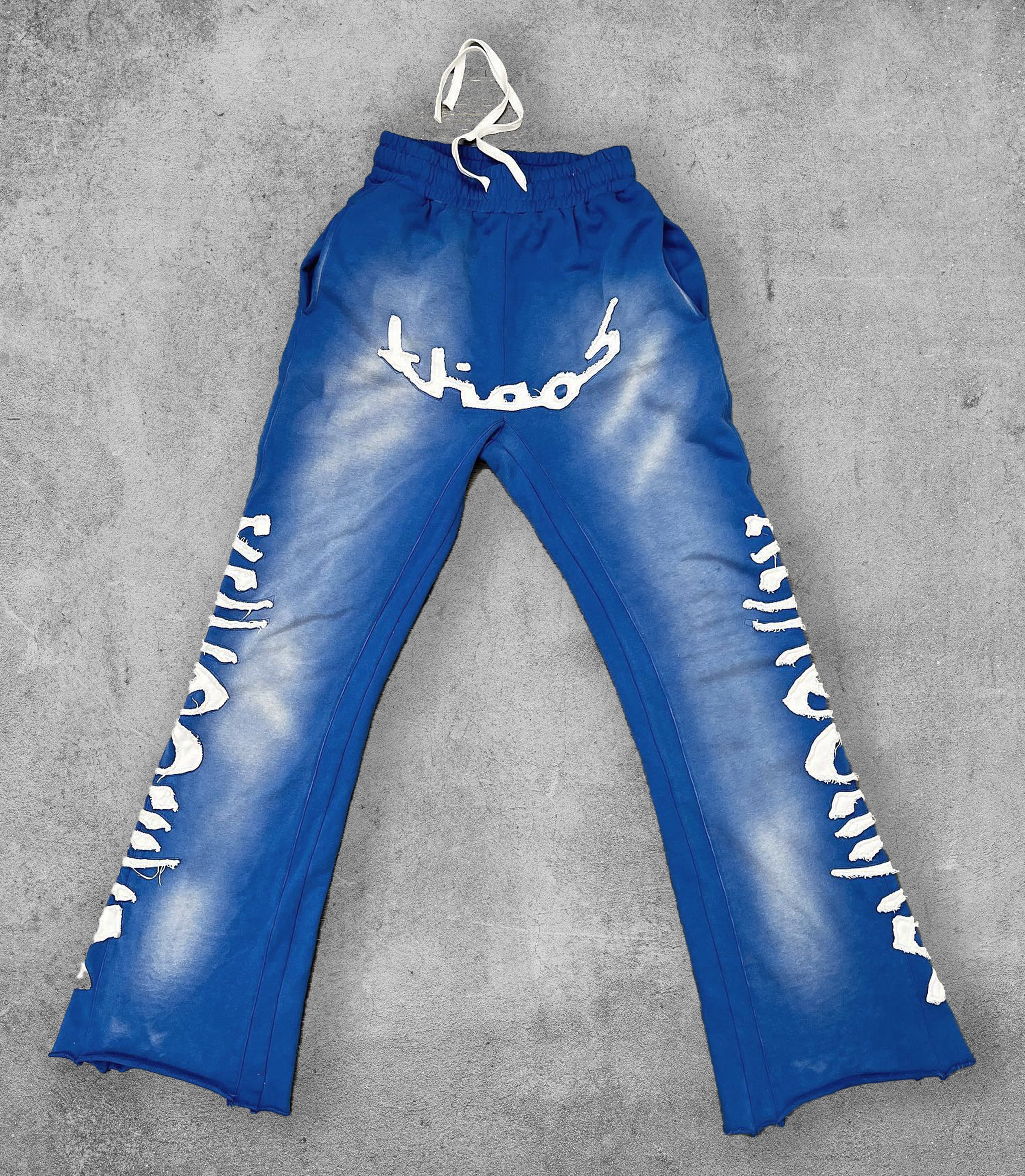 KHAÖS FLARED SWEATPANTS BLUE