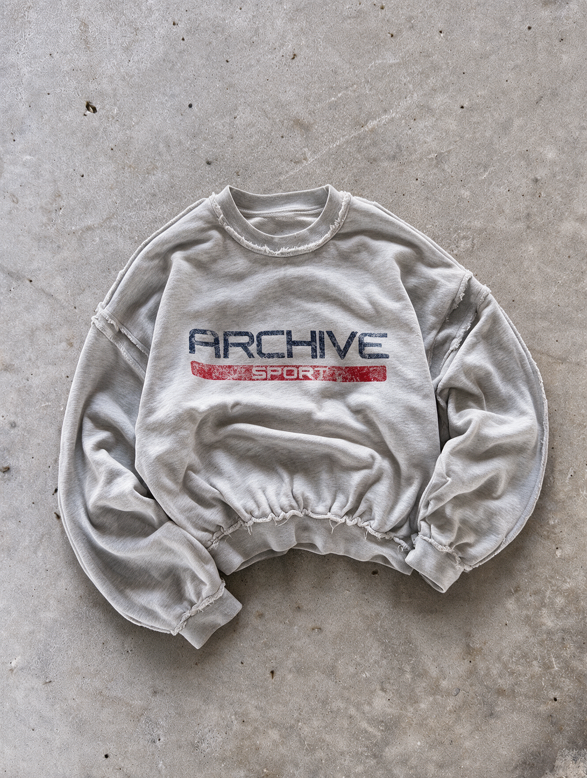 'ARCHIVE SPORT' distressed crewneck sweatshirt in gray, front flat-lay view 1