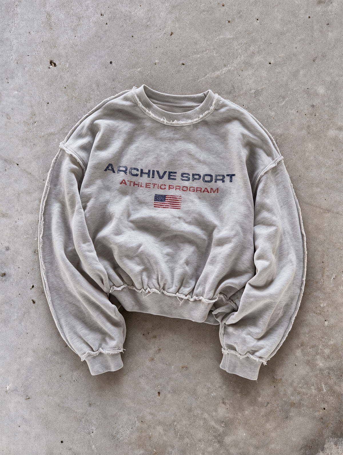 'ARCHIVE SPORT USA' distressed crewneck sweatshirt in gray, front flat-lay view 2