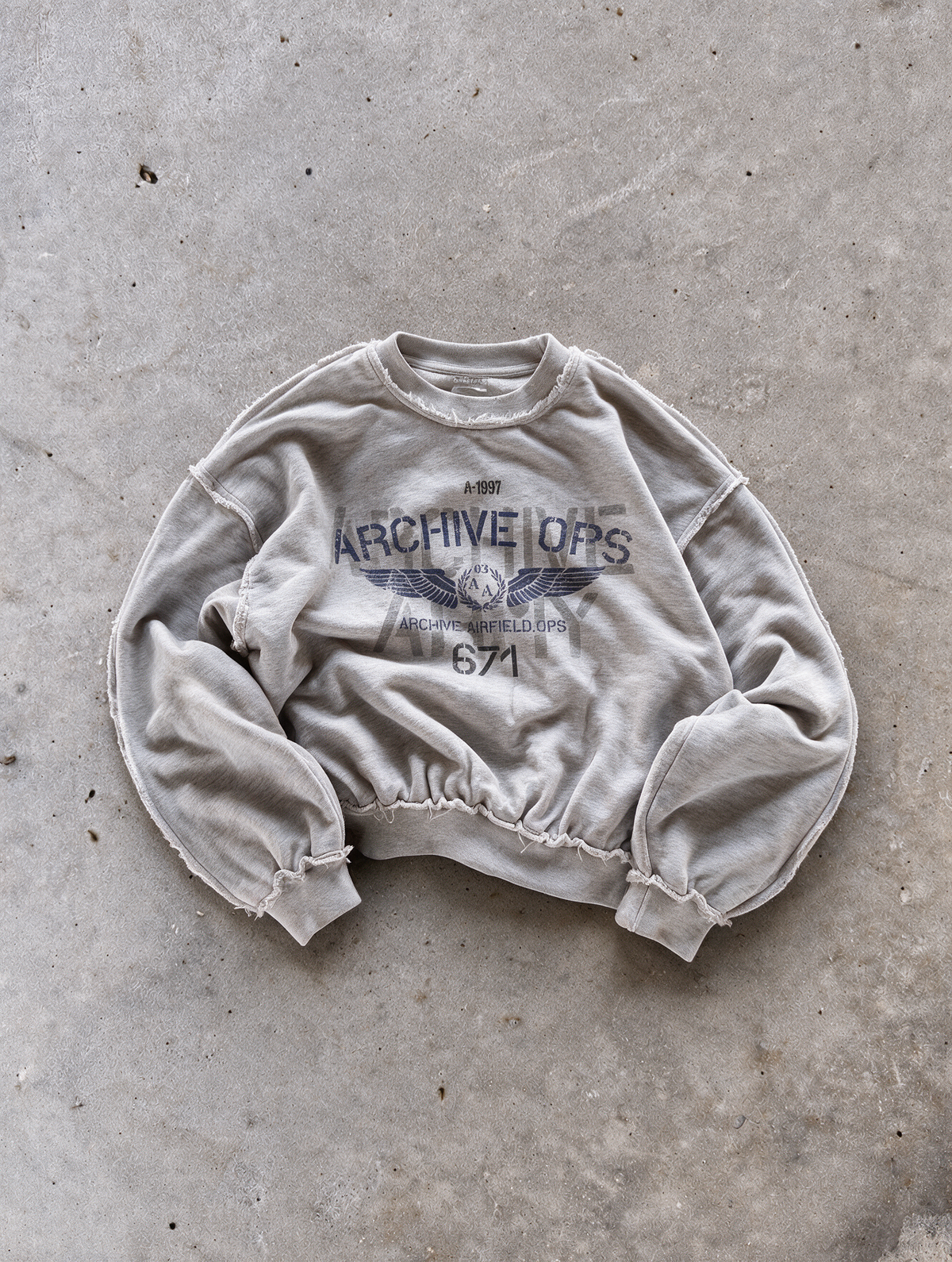 'AIRFORCE' distressed crewneck sweatshirt in gray, front flat-lay view 1
